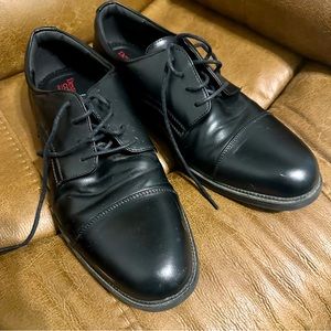 Men’s black dress shoes.